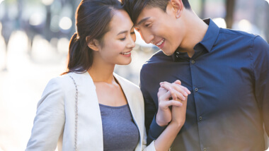 Happy and successful Asian couple in love
